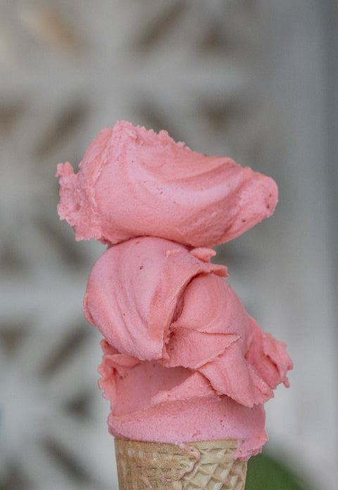 Product photo of Gelato by Pura Vida Miami cone stacked with pink ice cream scoops for e-commerce