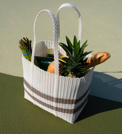 Product photo of white woven Ettie tote bag filled with fresh groceries in Miami