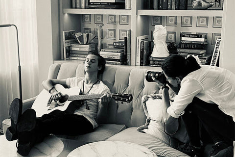 Behind the scenes of Anyelika Perez photographing musician playing guitar at the Good time hotel in south beach