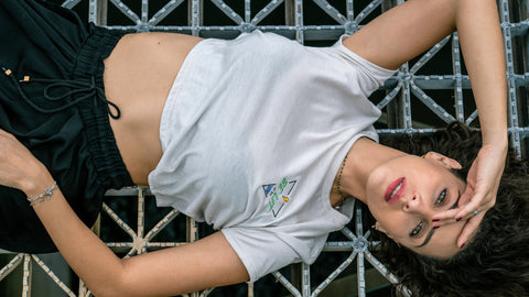 Portrait photography of woman lying on metal grid in sporty outfit for lifestyle campaign